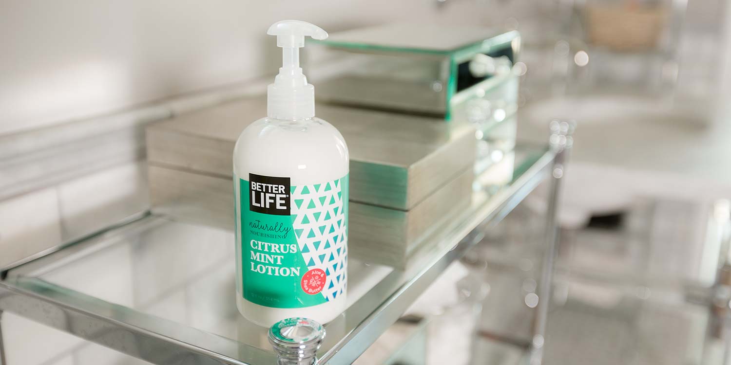 Better Life's Citrus Mint Lotion sitting on top of a glass counter inside a room