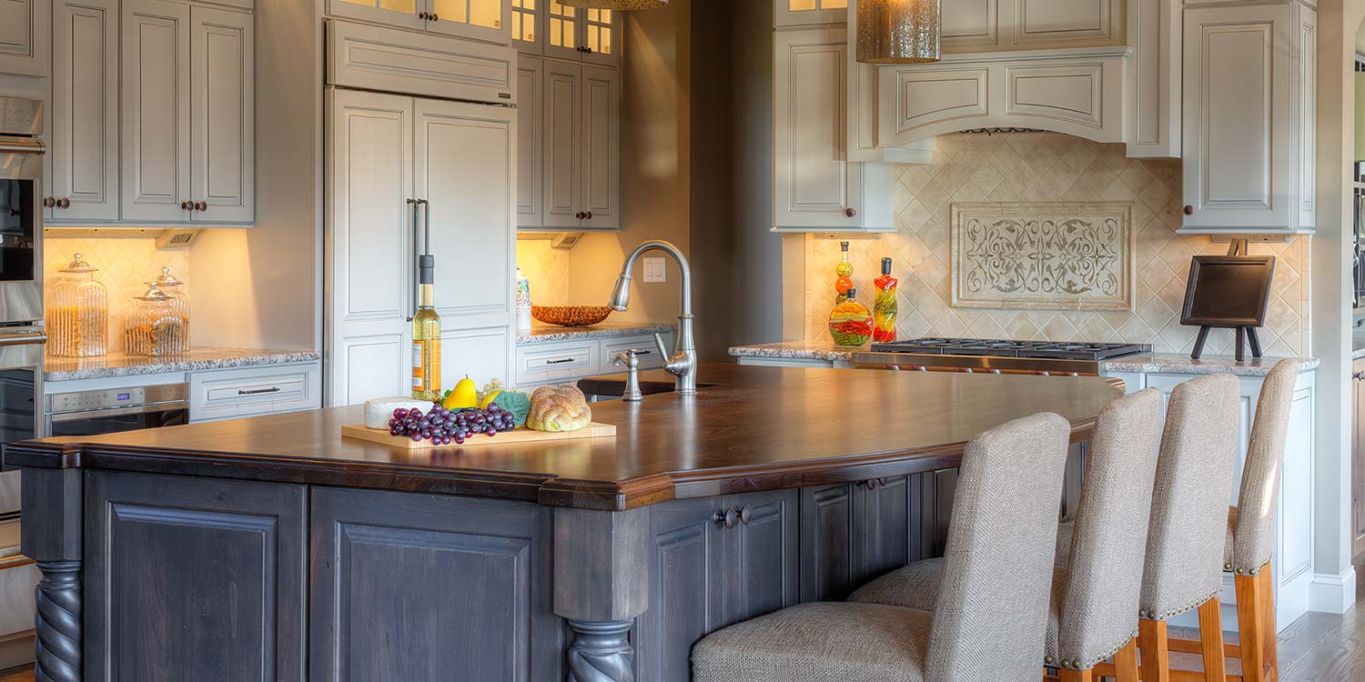 An image of a complete kitchen featuring a beautiful, custom, wood countertop