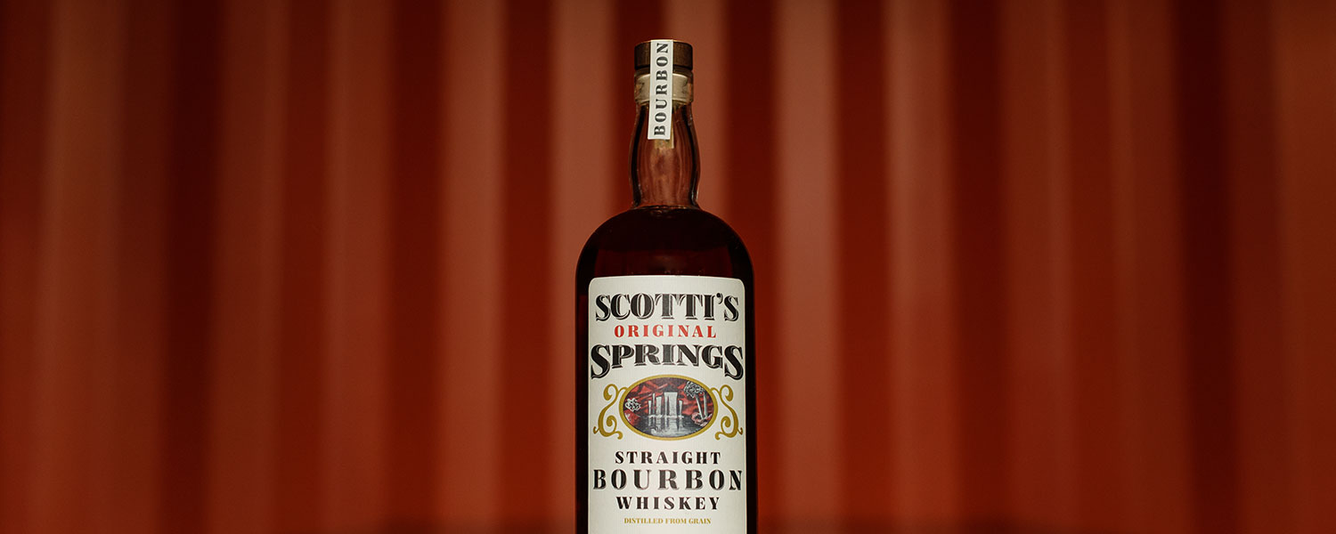 Scotti's bottle with red stripe backdrop